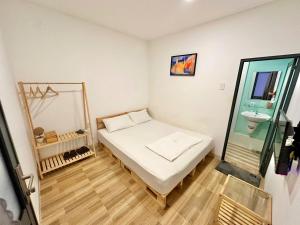 Un pat sau paturi într-o cameră la Như Mây Homestay +30 fotografii