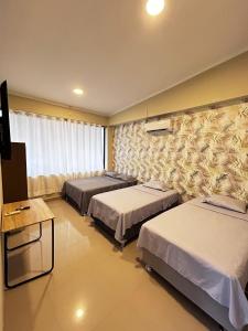 Postel nebo postele na pokoji v ubytování Hostal Cordillera Azul