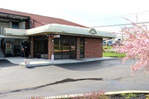 a building with a parking lot in front of it at Elkton Lodge - Newark - Elkton University Gateway in Elkton