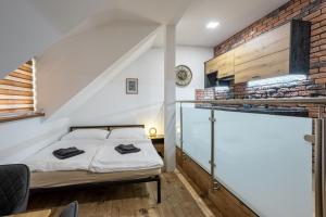 Katil atau katil-katil dalam bilik di Apartmány U Doskočilů