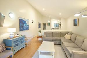 a living room with a couch and a table at Oceanhaus - Margaret River in Margaret River Town