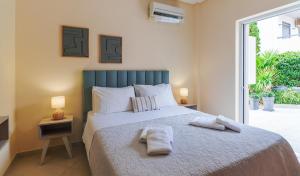 Ένα ή περισσότερα κρεβάτια σε δωμάτιο στο Aristea Apartments