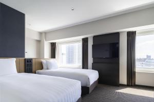 Postel nebo postele na pokoji v ubytování ANA Crowne Plaza Sapporo by IHG + 37 fotografií