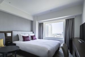 Postel nebo postele na pokoji v ubytování ANA Crowne Plaza Sapporo by IHG