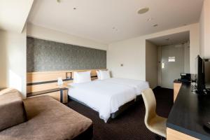 Postel nebo postele na pokoji v ubytování ANA Crowne Plaza Sapporo by IHG