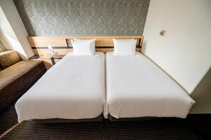 Postel nebo postele na pokoji v ubytování ANA Crowne Plaza Sapporo by IHG