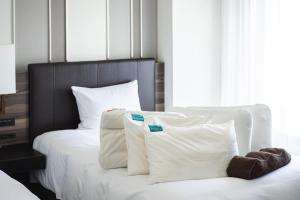 Postel nebo postele na pokoji v ubytování ANA Crowne Plaza Sapporo by IHG