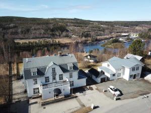 an aerial view of a house and a river at The Cloudberry Hostel in Näsåker