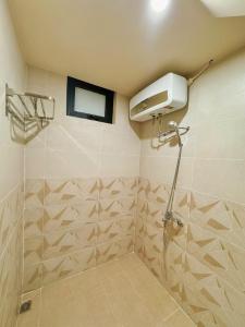 a bathroom with a shower with a window and a shower at Cherish Villa - Near Mountain and Beach - Sơn Trà in Da Nang