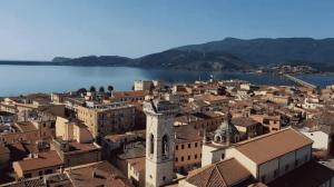 an aerial view of a town next to a body of water at Flamingo View apartment in Orbetello