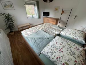 Ένα ή περισσότερα κρεβάτια σε δωμάτιο στο Ferienhaus Ingeborg