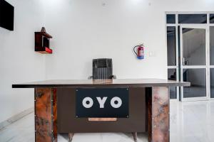 a table with an ovo sign on it at Hotel O Signature hotel in Meerut