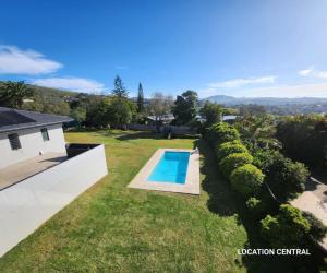 an aerial view of a backyard with a swimming pool at Modern, Comfy Guest Suite with Beautiful Views in Tygerberg Hills