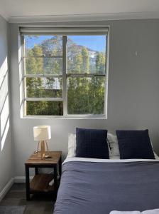 Postel nebo postele na pokoji v ubytování Manly Bunkhouse