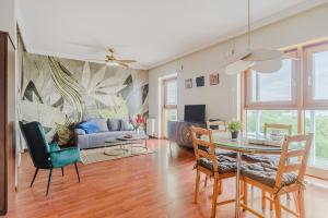 Televízia a/alebo spoločenská miestnosť v ubytovaní Westfield Arkadia P&O Serviced Apartments