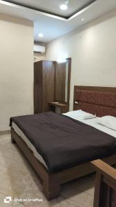 Letto o letti in una camera di Hotel Sangam sagar