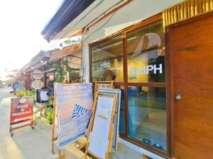 a store front with a sign in front of it at Suites by Eco Hotels in El Nido