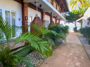 a house with plants on the side of it at Suites by Eco Hotels in El Nido