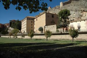 a large building with a hill in the background at Hotel Arabia in Albarracín