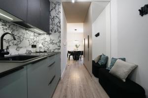 Kuchnia lub aneks kuchenny w obiekcie Promenada by Baltic Home