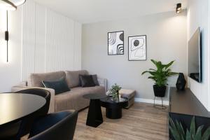Telewizja i/lub zestaw kina domowego w obiekcie Promenada by Baltic Home