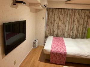 Postel nebo postele na pokoji v ubytování Town Hotel 41