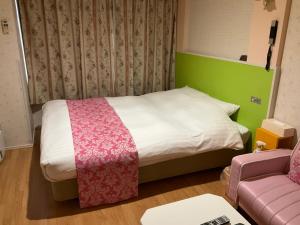 Postel nebo postele na pokoji v ubytování Town Hotel 41