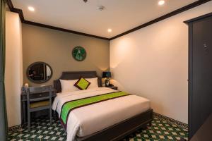 Charmpearl Hotel & Suites客房内的一张或多张床位