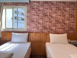 Bin Chen Business Hotelにあるベッド