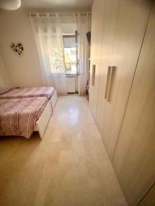 Postel nebo postele na pokoji v ubytování Pura Vida Mare Porto Recanati + 4 fotografie