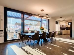 a dining room with a table and chairs at Monza Design Villa by GIOs Private Pool in Monza