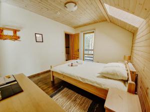 a bedroom with a large bed in a room at LVM tūrisma un atpūtas centrs "Spāre" in Spāre