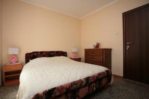 Ένα ή περισσότερα κρεβάτια σε δωμάτιο στο Apartments Simun