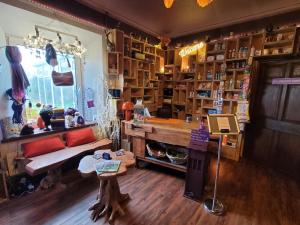 a shop with a table and a bench in a room at Private Luxury Glamping surrounded by wildlife in Pembrokeshire