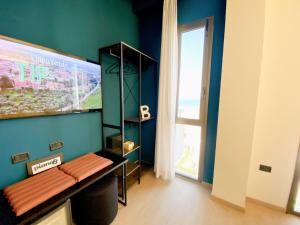 TV a/nebo společenská místnost v ubytování PianoB - Breakfast Hotel & Bar