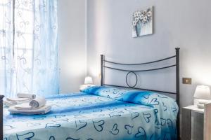 Postel nebo postele na pokoji v ubytování Agriturismo Tramonto in Maremma