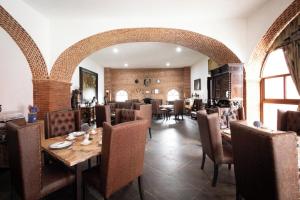 a dining room with a table and chairs at Hotel Boutique Nueva Escocia, Puebla in Puebla