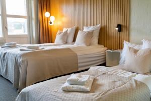 Letto o letti in una camera di Strandhotel Klitrosen