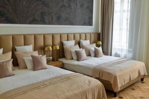 Posteľ alebo postele v izbe v ubytovaní Harmonia Palace + 37 fotografií