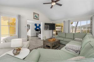 a living room with a couch and a table at Palm Beach Paradise by Bocobay in Palm-Eagle Beach
