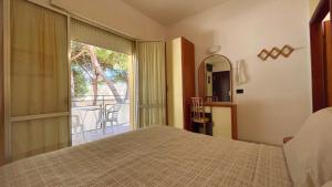 Postel nebo postele na pokoji v ubytování Hotel Zanella