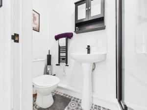 a bathroom with a toilet and a sink at Montrose in Darlington