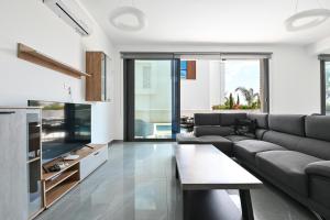 Et opholdsområde på By the Beach Villa 12