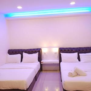 Sunsega Hotel客房内的一张或多张床位