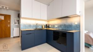 Kuchyň nebo kuchyňský kout v ubytování Apartamenty - Krynica Morska Enklawa I