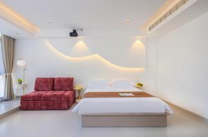 Postel nebo postele na pokoji v ubytování Yangshuo Shiqing Yuewan Hotel