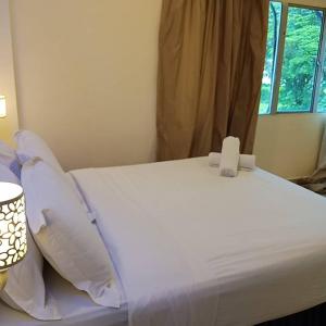 Sunsega Hotel客房内的一张或多张床位