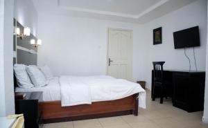Katil atau katil-katil dalam bilik di Option one hotel and suite