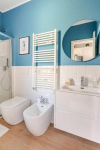 a bathroom with a sink and a toilet and a mirror at TheKeyStudio, Stella Marina Suite in Bordighera +19 photos