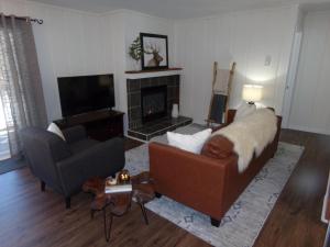 a living room with a couch and a fireplace at Blue River Condos 3 Bed 2 Bath BRLR in Blue River